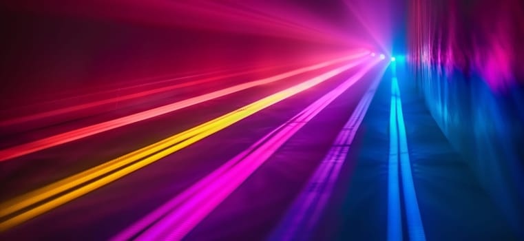 A colorful display of lights, including shades of purple, pink, magenta, and electric blue, illuminates the dark sky, creating a vibrant visual effect reminiscent of lens flares reflecting off water