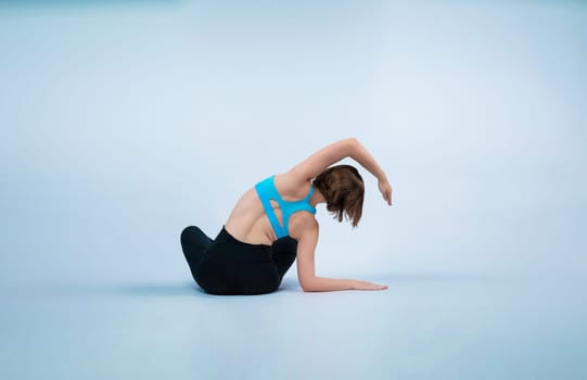 Full body length back rear view gaiety shot athletic and sporty woman doing healthy and meditative yoga exercise workout posture on isolated background. Healthy active and body care lifestyle