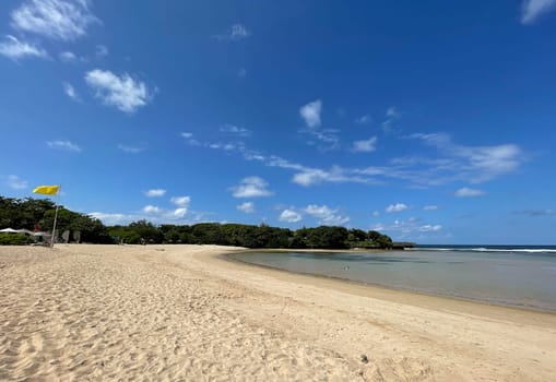 Tropical beach in sunny weather with blue sky and white sands Panorama of a beautiful white sand beach and turquoise water, Holiday summer beach background Wave of the sea on the sand beach