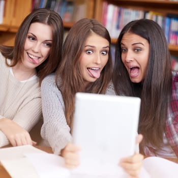 Women, students or tablet selfie in college library or bonding together for crazy update on social media. Learners, touchscreen or post online as goofy friends or solidarity with care in university.