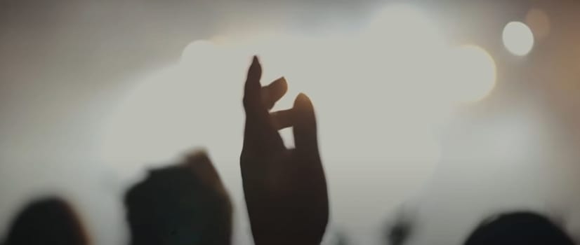 Blurry background picture of hand reaching out for God's help, good for your multimedia content background or card design