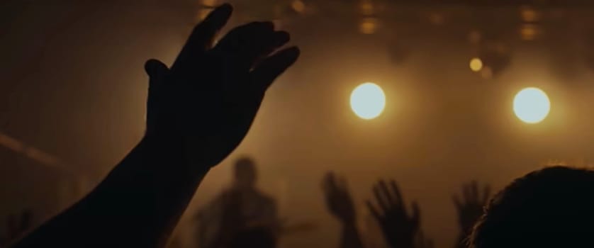 Blurry background picture of hand reaching out for God's help, good for your multimedia content background or card design