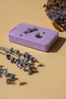 Handmade aromatic spa lavender soap. Natural additives and extracts. Bar of lavender soap with dried flowers. Beauty treatment product herbal ecological organic cosmetics. Copy space