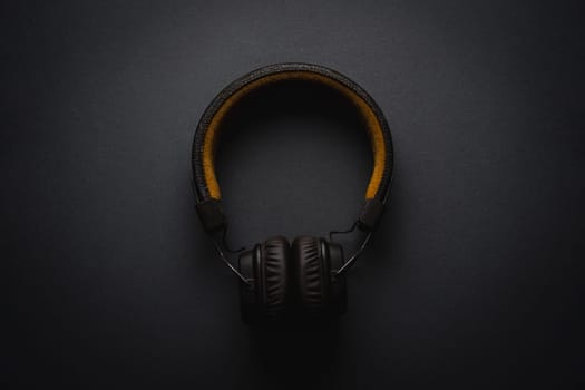 Retro style wireless over-ear headphones on dark gray background
