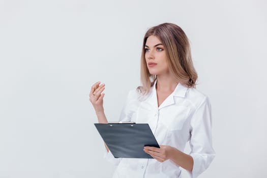 Medical physician doctor woman in white coat holding folder with documents and talking to someone