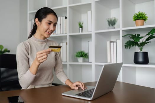 Woman on desk with smartphone, credit card and ecommerce payment for online shopping at home.