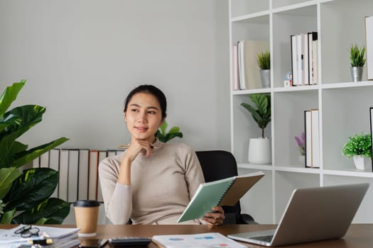 Business woman sitting thinking about work and planing with connected at home.