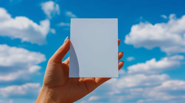 A person holding a blank white card in their hand