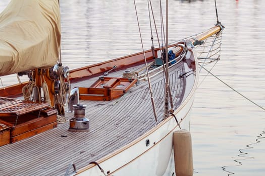 An old-fashioned yacht docked in detail