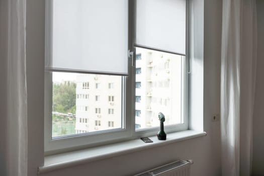 Light room with window and open curtains. Home interior. High quality photo