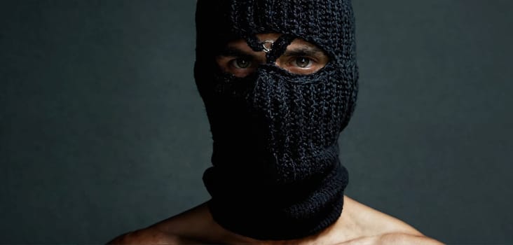 Criminal in a black mask. Close-up. Generative AI. High quality photo