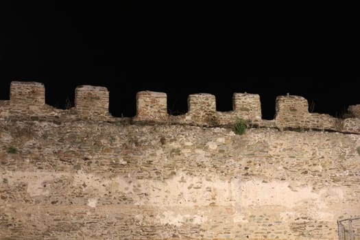 Journey through time and immerse yourself in the mystical allure of Thessaloniki's ancient city walls under the cloak of night