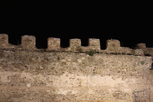 Journey through time and immerse yourself in the mystical allure of Thessaloniki's ancient city walls under the cloak of night