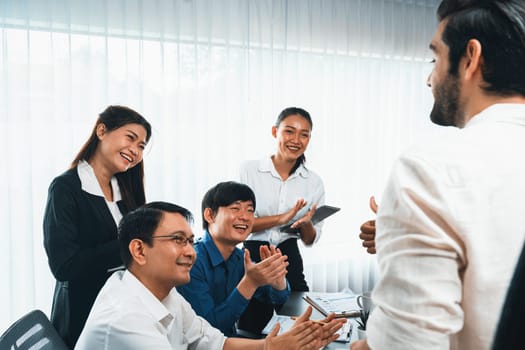 Excited and happy office worker employee celebrate after make successful strategic business marketing planning. Teamwork and positive attitude create productive and supportive workplace. Prudent