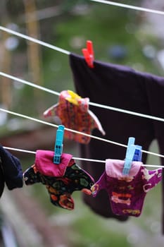 Embrace eco-friendly menstruation with these empowering images of reusable period pads hanging out to dry.