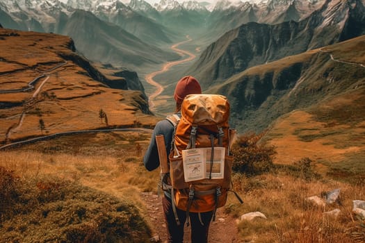 A traveler with a backpack overlooking a scenic mountain valley and winding river.