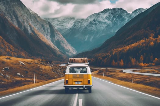 Vintage yellow van driving through mountainous landscape with autumn foliage.