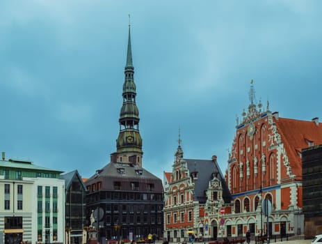 City Hall Square with House of the Blackheads and Saint Peter church in Riga Old Town During sunset time.1