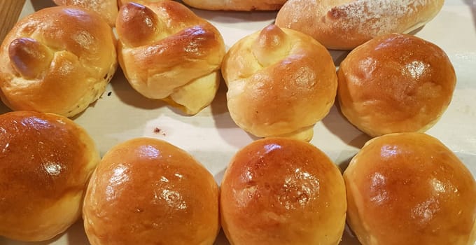 Fresh Baked soft bread rolls and hard bread rolls. Warm Fresh Buttery Rolls. good for your multimedia content background and restaurant menu