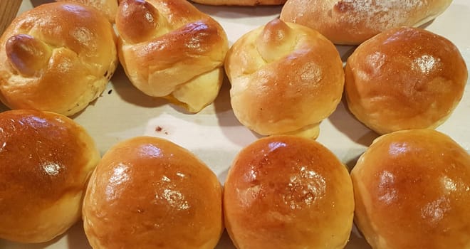 Fresh Baked soft bread rolls and hard bread rolls. Warm Fresh Buttery Rolls. good for your multimedia content background and restaurant menu