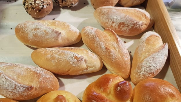 Fresh Baked soft bread rolls and hard bread rolls. Warm Fresh Buttery Rolls. good for your multimedia content background and restaurant menu