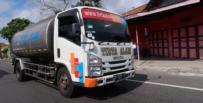 trucks making local commercial delivery at urban city and on the city streets in asia logistical transport system in Indonesia