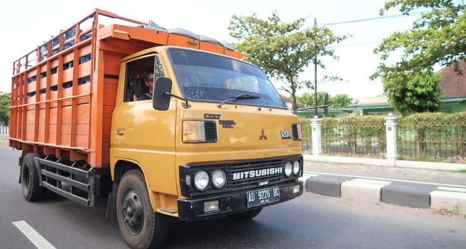 trucks making local commercial delivery at urban city and on the city streets in asia logistical transport system in Indonesia