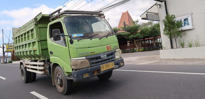 trucks making local commercial delivery at urban city and on the city streets in asia logistical transport system in Indonesia