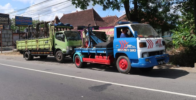 trucks making local commercial delivery at urban city and on the city streets in asia logistical transport system in Indonesia