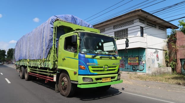 trucks making local commercial delivery at urban city and on the city streets in asia logistical transport system in Indonesia