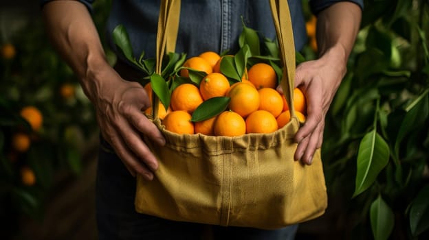 Basket of tangerines in the hands of a man in the garden. The concept of recycling, saving, no plastic, proper nutrition, healthy lifestyle, diet, veganism, vegetarianism, gardening and farming, fresh fruit