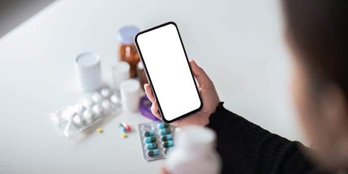 Mock up smartphone smartphone in the hands of patient of medicine. instruction for use.