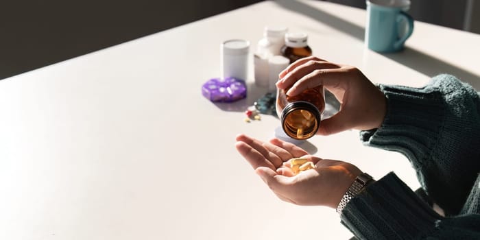 Close up woman holding pill in hand with water. Female take tablet from headache, painkiller, Healthcare, medicine, treatment. therapy concept.