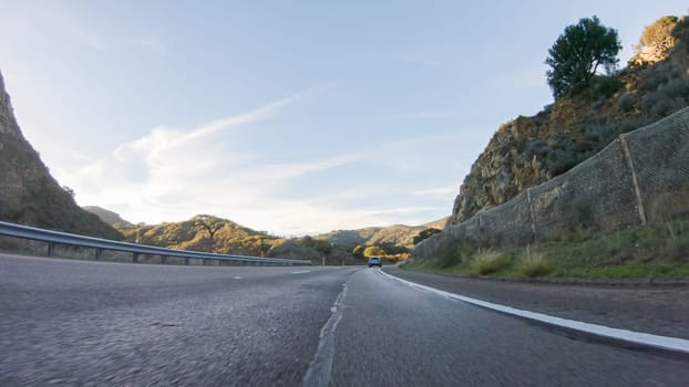 Basking in the beauty of a sunny winter day, driving on HWY 1 near Las Cruces, California offers stunning views of the picturesque coastal landscape against a backdrop of clear blue skies.