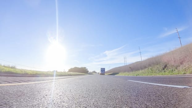 During the day, driving on HWY 101 near Arroyo Quemada Beach, California, offers scenic views of the surrounding coastal landscape.