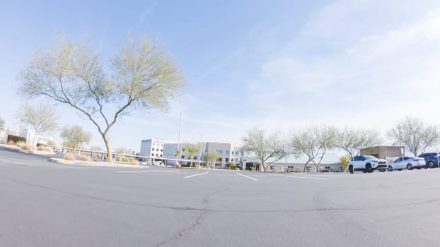 Driving through a bustling Las Vegas residential neighborhood during the day reveals the vibrant energy and unique architectural styles that make the city's communities so captivating.