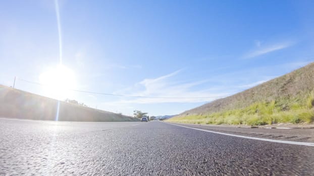 During the day, driving on HWY 101 near Arroyo Quemada Beach, California, offers scenic views of the surrounding coastal landscape.