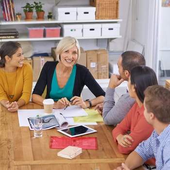 Startup, leadership and senior woman in business meeting for planning, collaboration and strategy in office. Happy manager, tablet and diverse group of people for discussion, idea or teamwork.