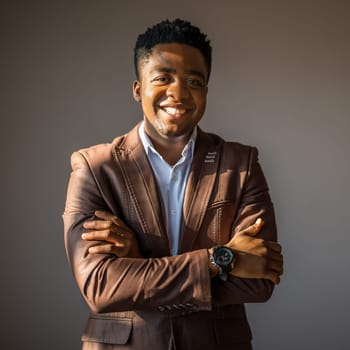 Portrait of happy businessman who is smiling and looking at camera.