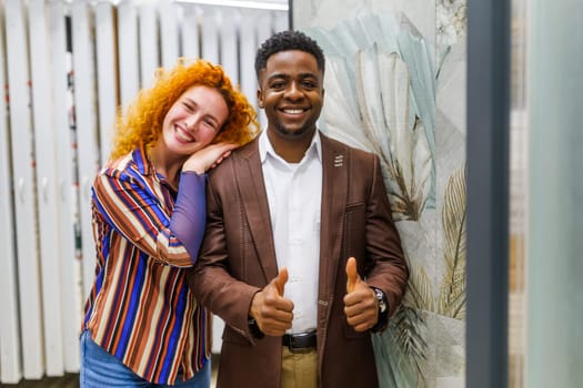 Portrait of young couple who owns small business bath store. Man and woman work in partnership.