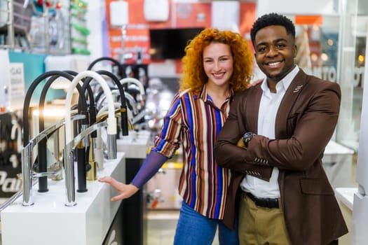 Portrait of young couple who owns small business bath store. Man and woman work in partnership.