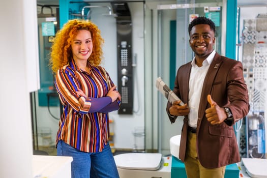 Portrait of young couple who owns small business bath store. Man and woman work in partnership.