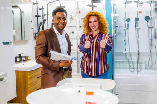 Portrait of young couple who owns small business bath store. Man and woman work in partnership.