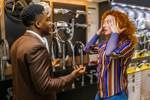 Couple choosing faucet for their apartment. They are arguing.