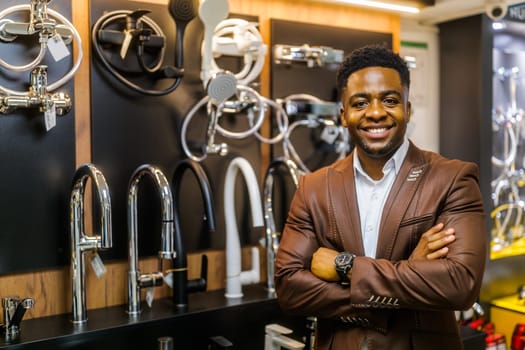 Portrait of salesperson in bathroom store. Happy man works in bath store. Sales occupation.