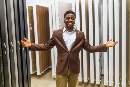 Portrait of salesperson in bathroom store. Happy man works in bath store. Sales occupation.