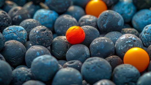 A bunch of blue and orange balls are sitting on top of each other