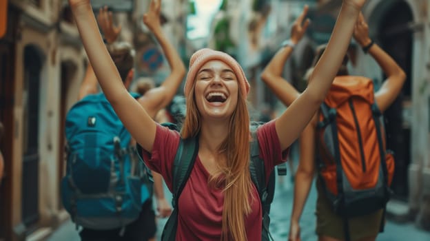 A woman with her arms up in the air and a group of people behind