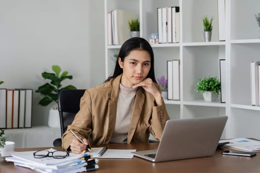 business woman entrepreneur in office using laptop at work, smiling professional female company executive wearing suit working on computer at workplace.