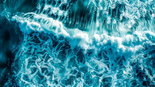Aerial view of the intricate patterns of foam and waves on the sea